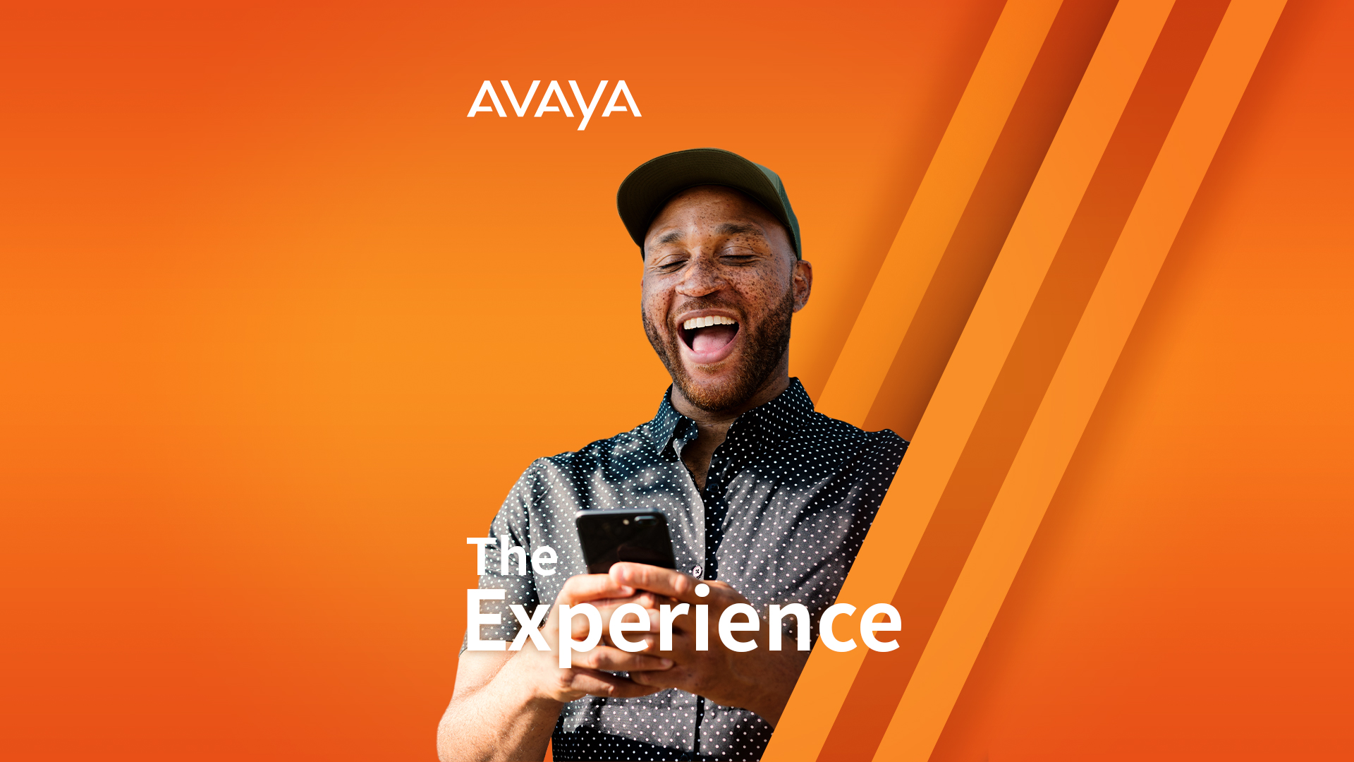 Man smiling and looking at his phone 