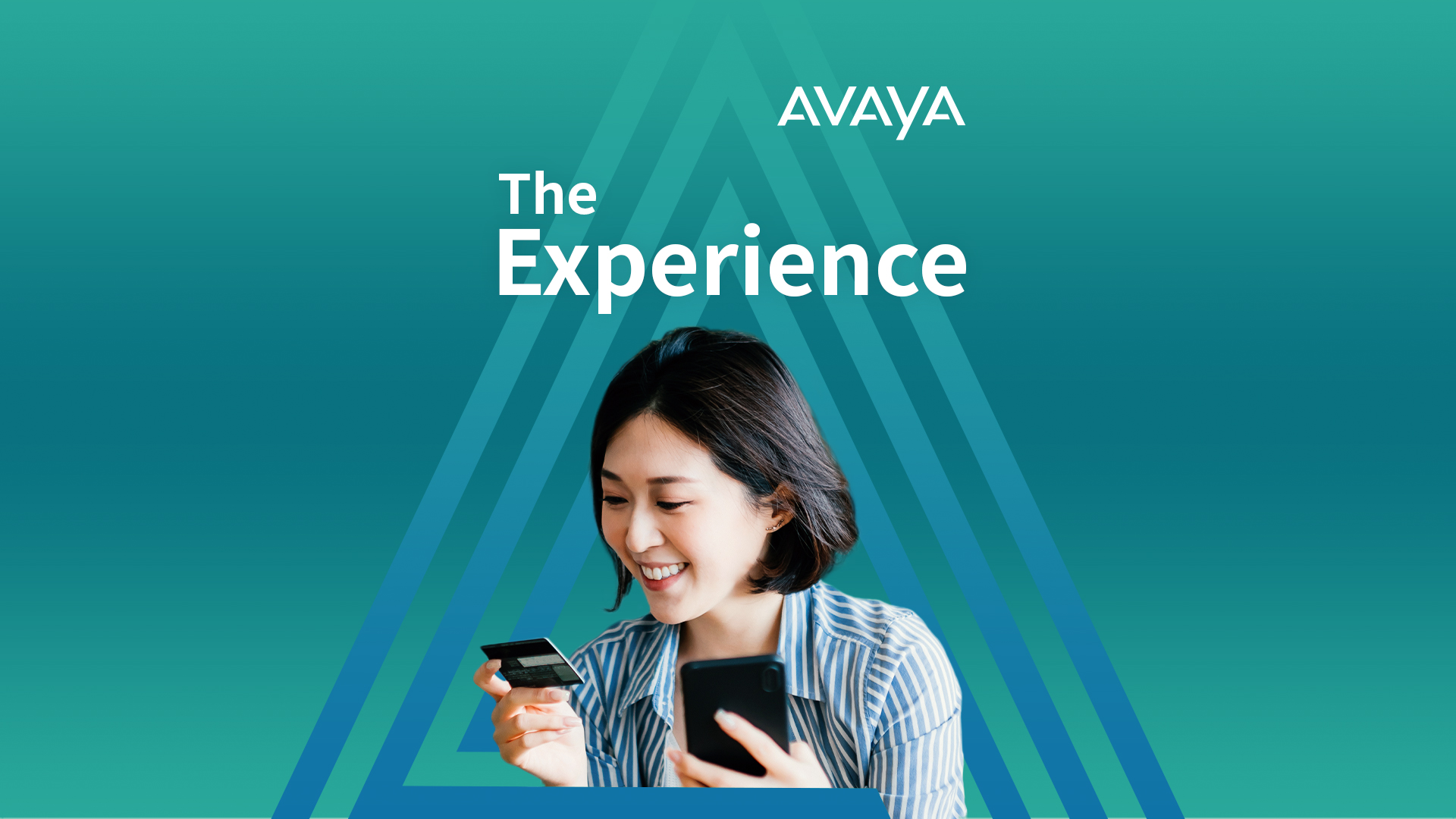 Woman holding and looking at credit card in one hand and holding iPhone in another 