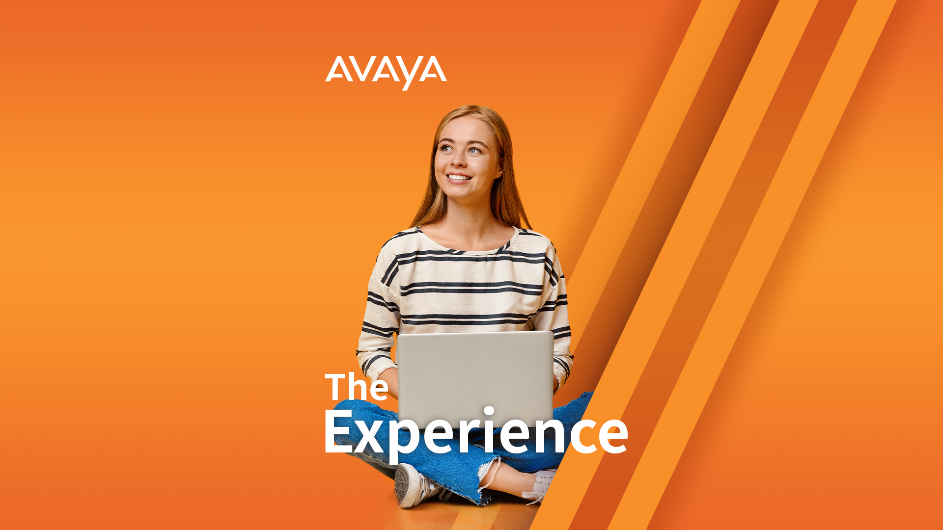 Woman on laptop looking up and smiling