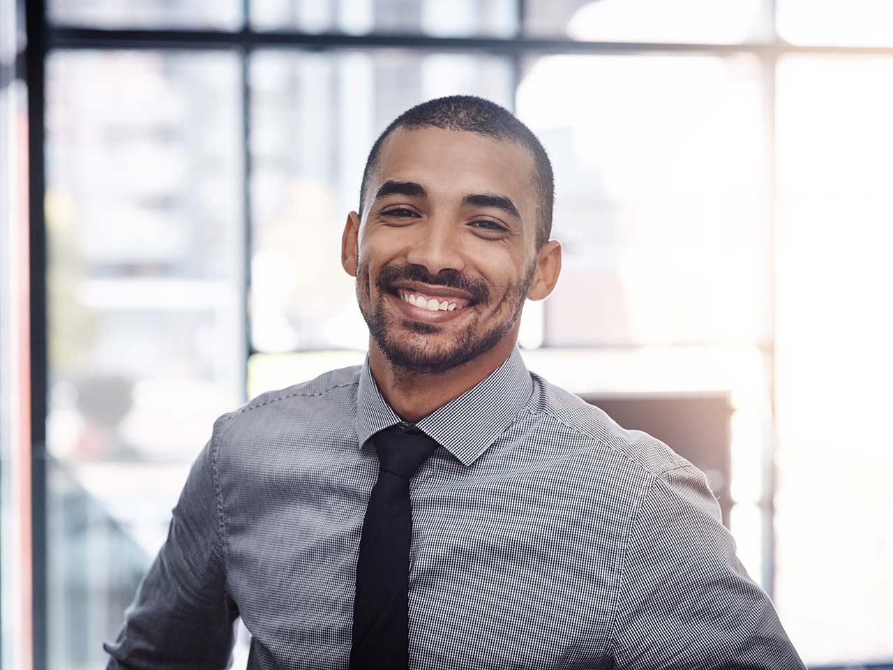 Smiling man in shirt and tie 