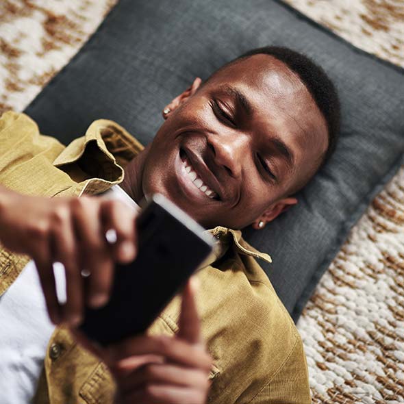 Man on phone receiving text