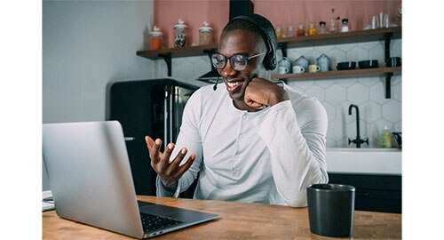 African American call center agent on his laptop at home 
