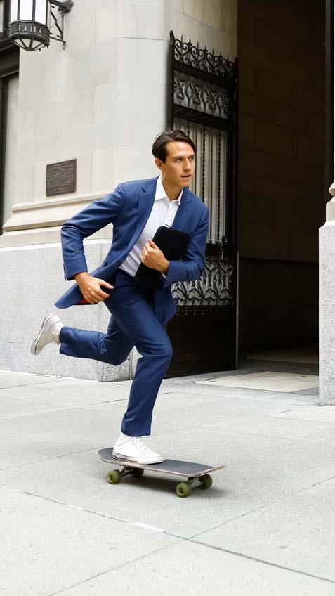 Smiling man on skateboard