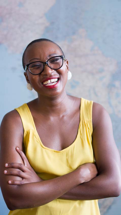 Smiling woman with arms crossed