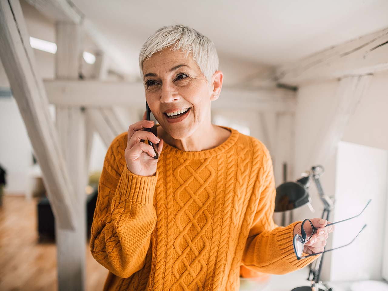 Smiling woman on cell phone.