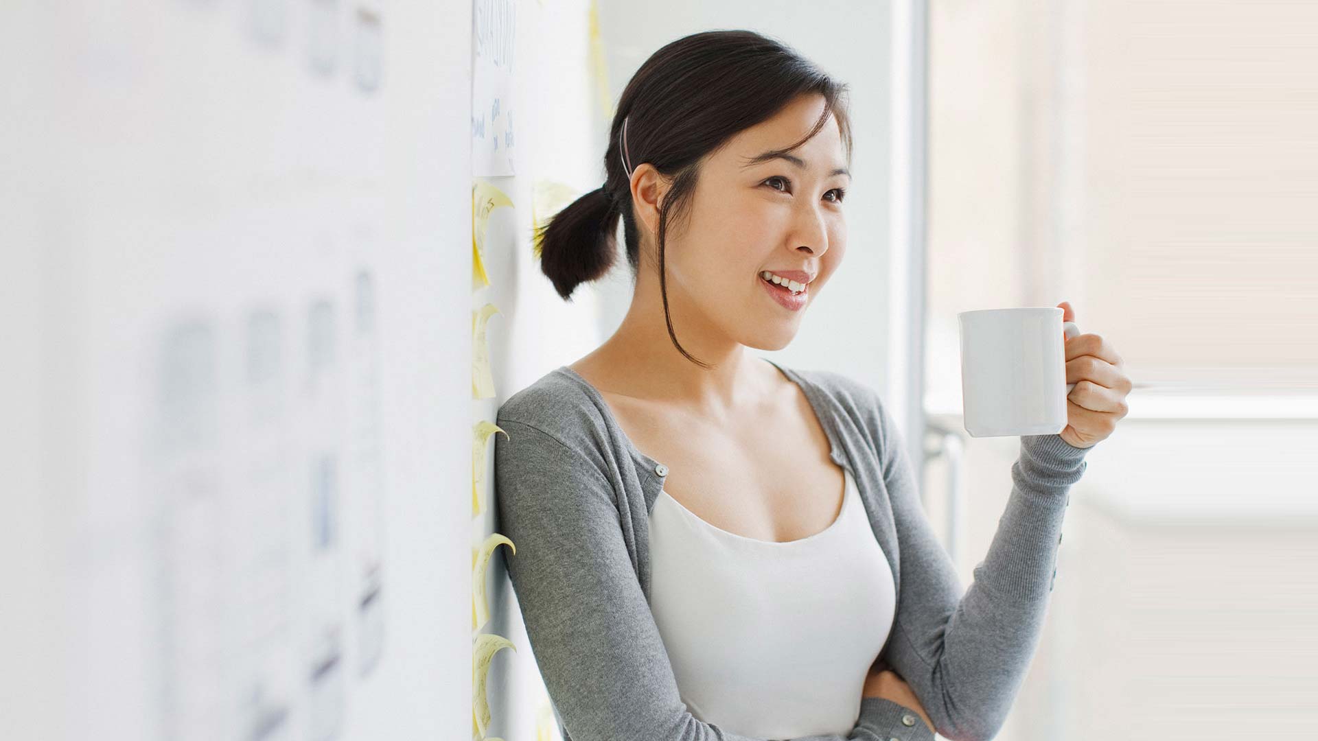 Woman standing in front of a wall