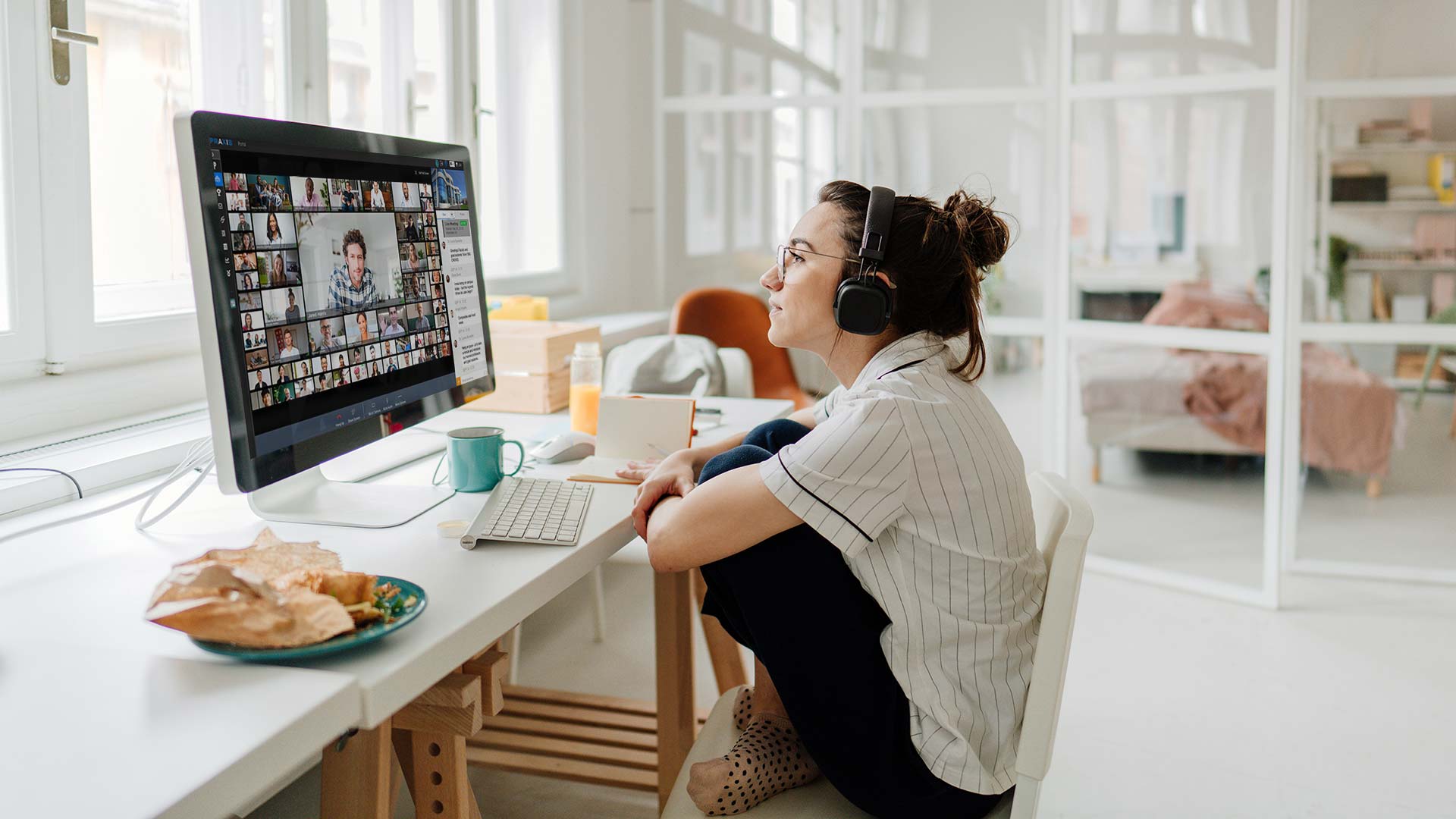 Woman wearing a headset on a video call.