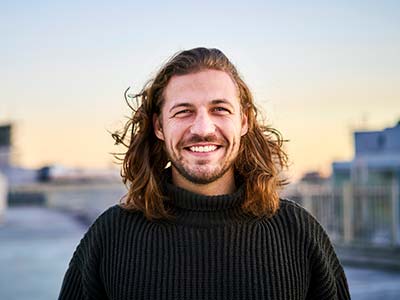 Portrait of bearded young man smiling