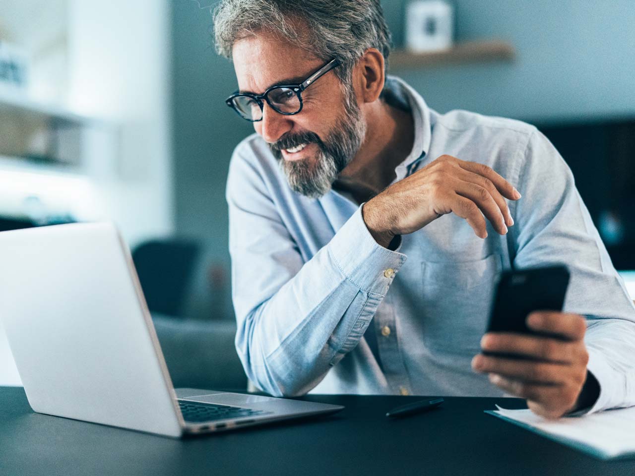 man on his computer having a video conference 