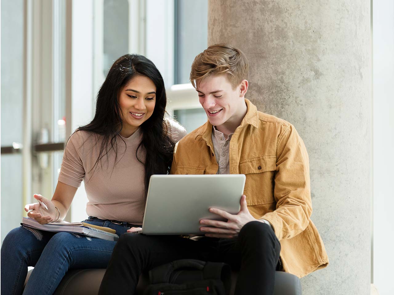 College students working on laptop