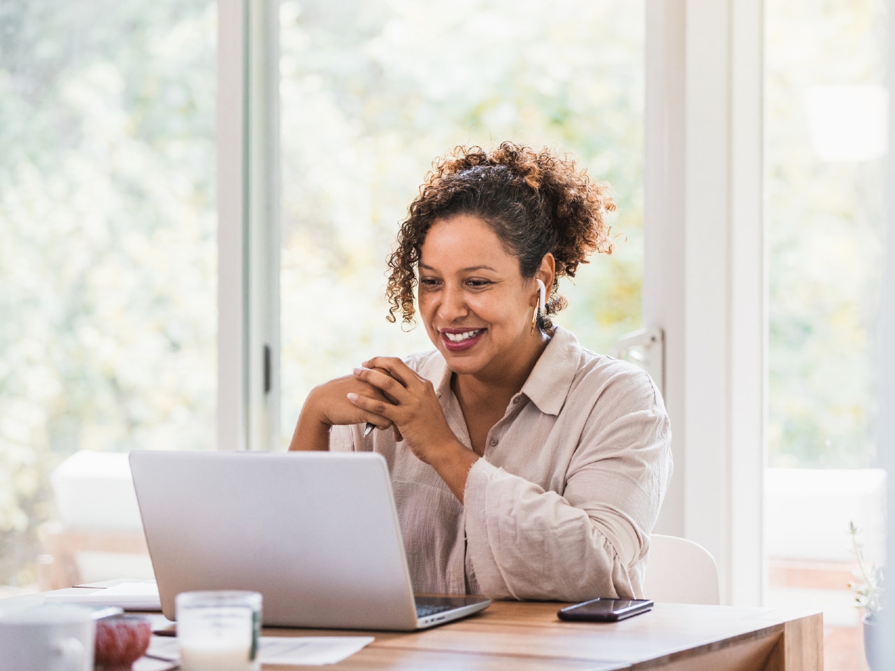 Woman attending a video conference on her laptop