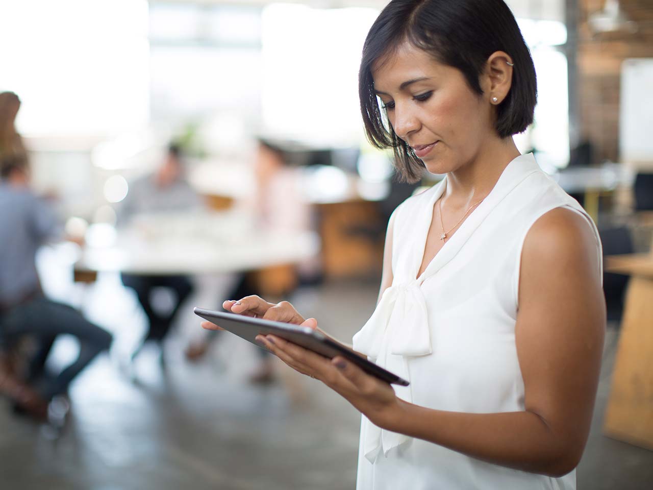 Woman scrolling on a tablet