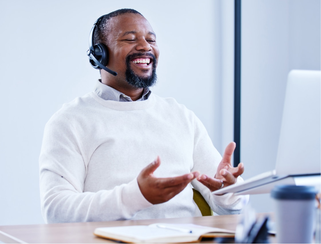 person laughing with headset